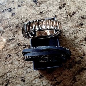 Swarovski bracelets one is a bangel the other is blue leather with crystals